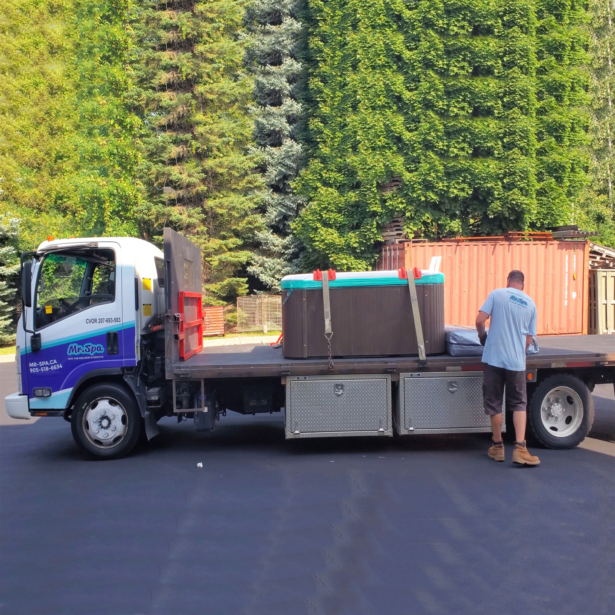  Technician performing a spa delivery in Ottawa